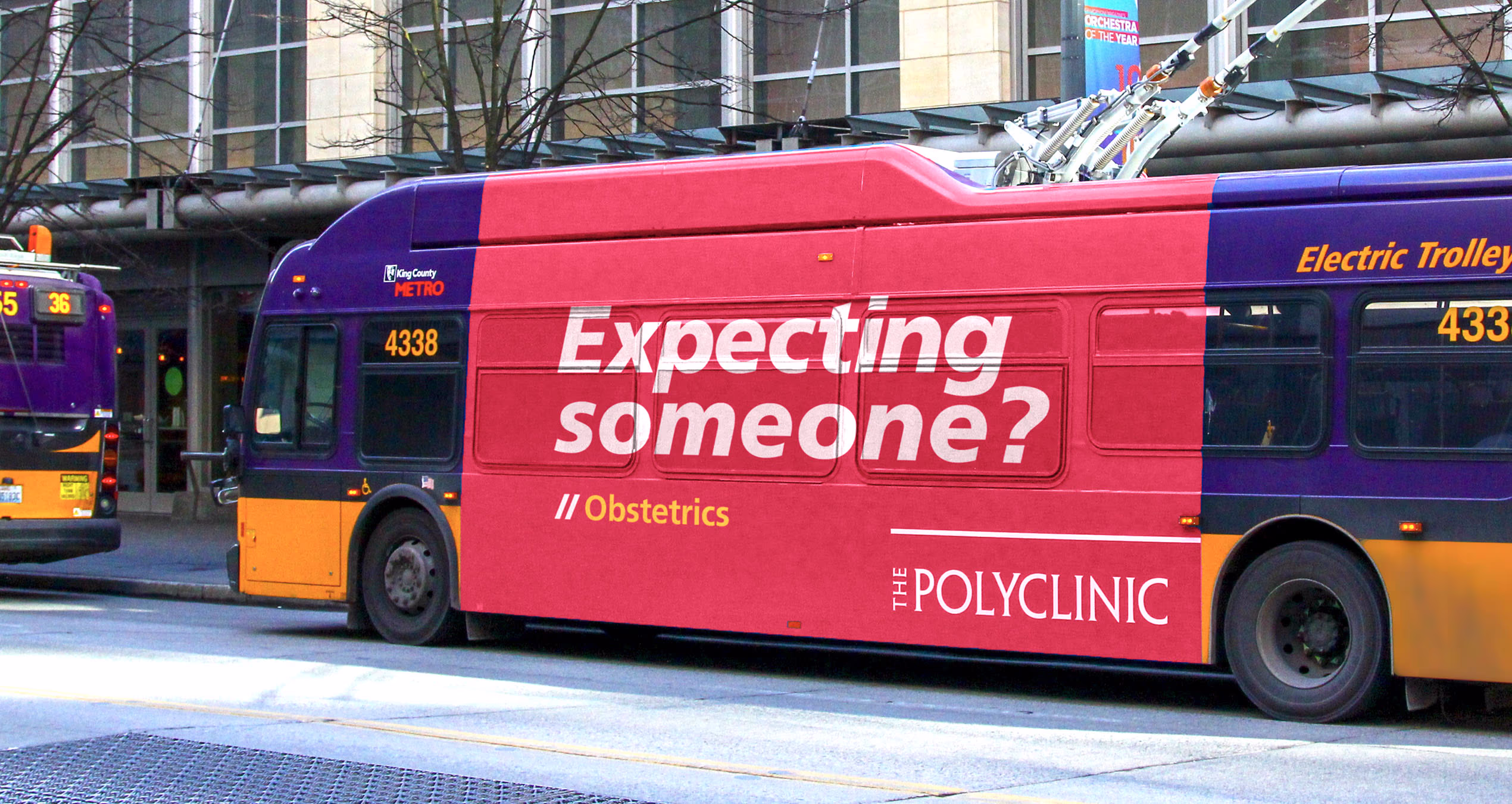 City bus featuring an ad for The Polyclinic. Bold text headline: Expecting Someone?