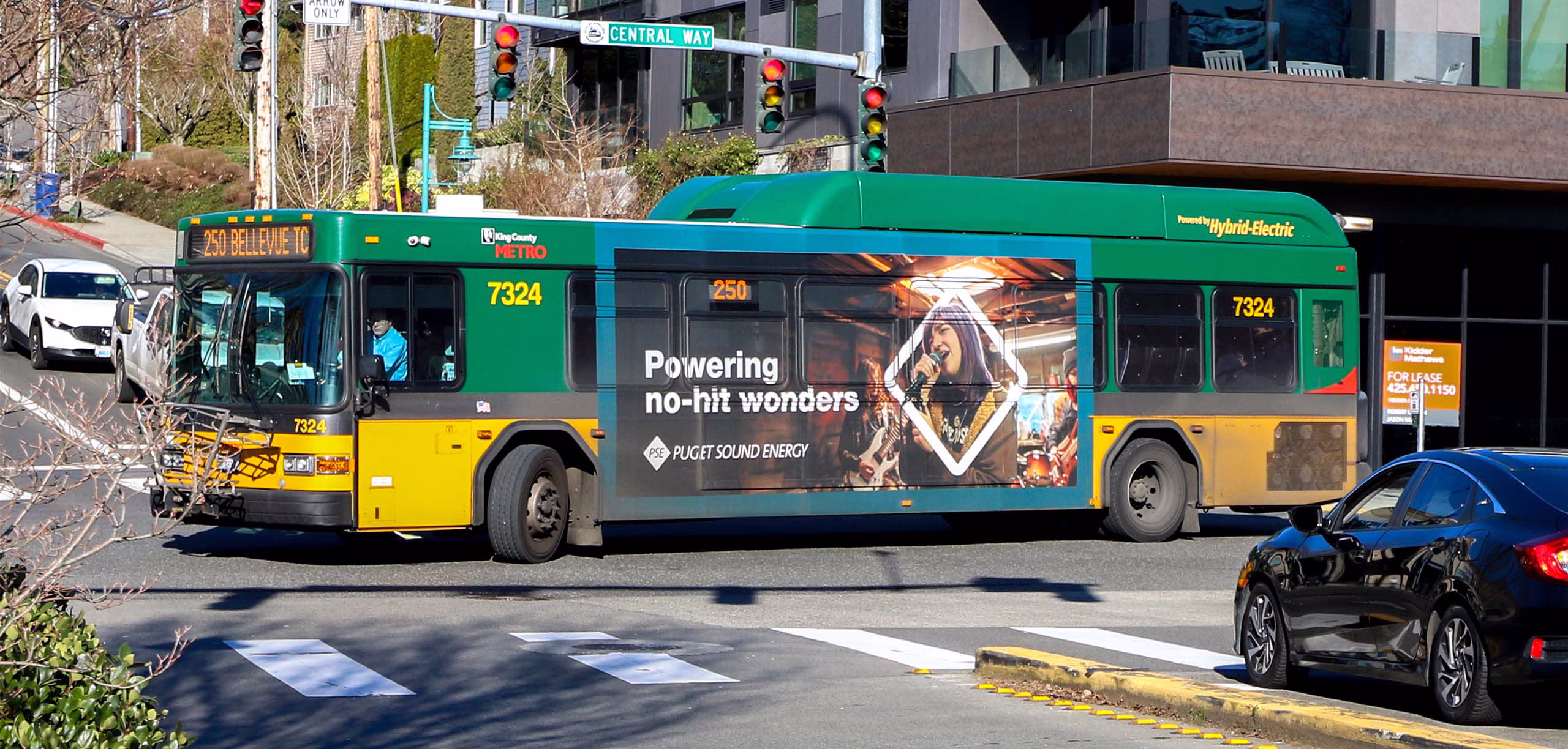 City bus with PSE ad of singer. Headline: Powering no-hit wonders